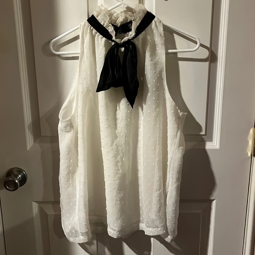 Sleeveless baby doll top, high collar, black satin bow. Size large